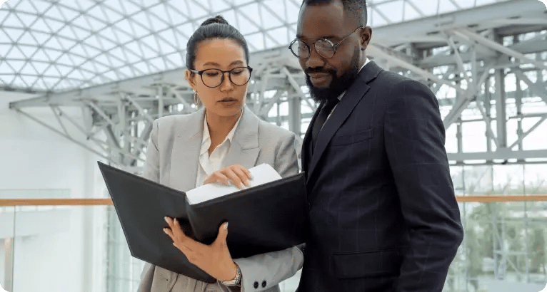 img-Two colleagues reviewing documents